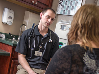 Dr. Brett Malchow speaks with a patient