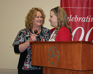 Debra Cromer receives the DAISY Award.