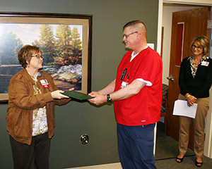 James Buettner, BSN, RN receives the DAISY award.